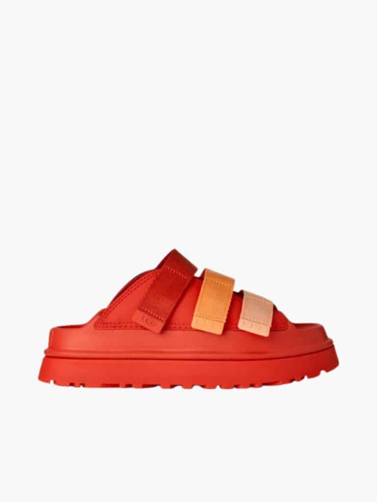 סנדלי נשים UGG דגם GoldenGlow Slide בצבע כתום מולטי עם רצועות סקוץ' מתכווננות וסוליית פלטפורמה קלה.